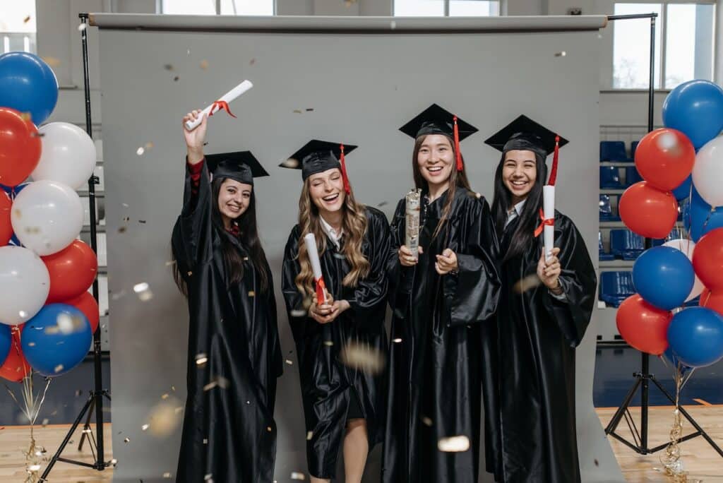 graduates posing in photo booth